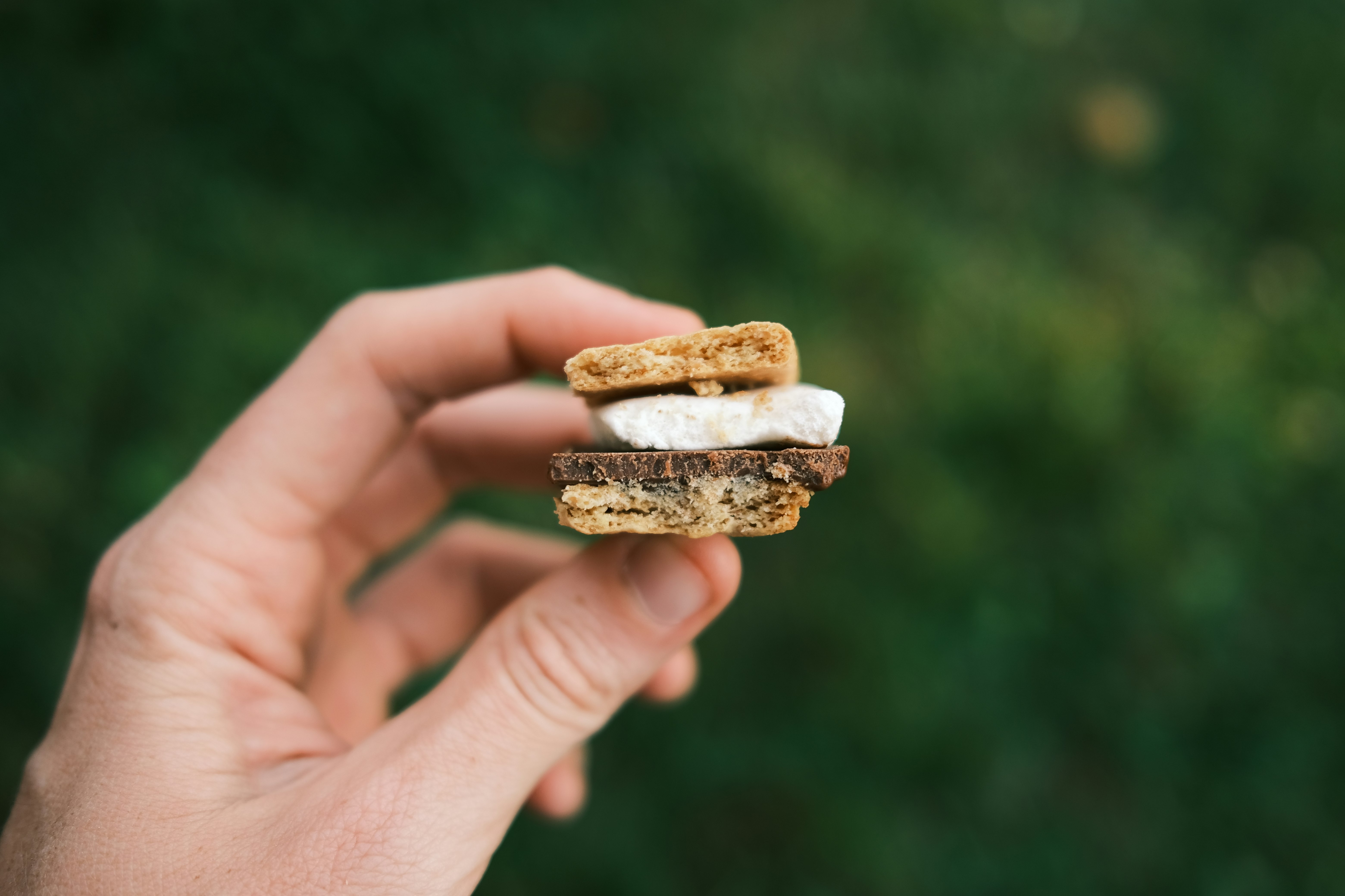 person holding a bread with chocolate